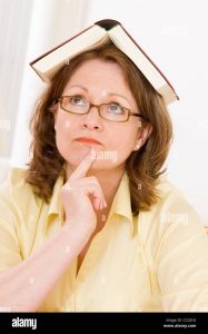 Woman balancing a book on her head